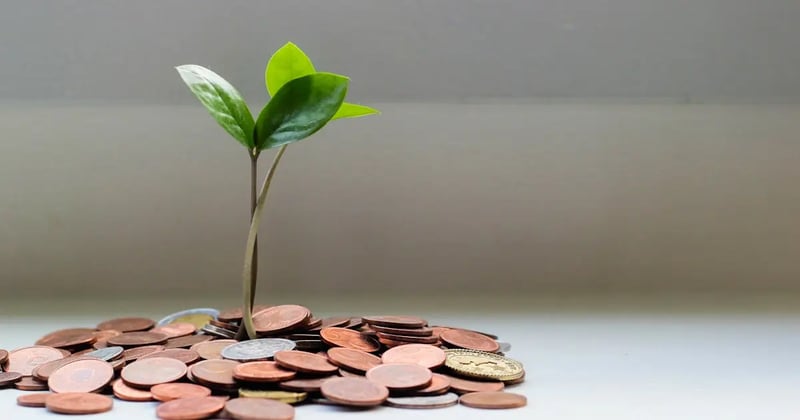 Investment decision concept with balance scale and financial charts