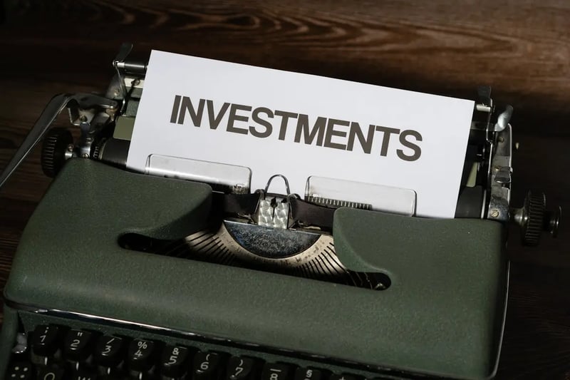 Person planning mutual fund investment with calculator and documents