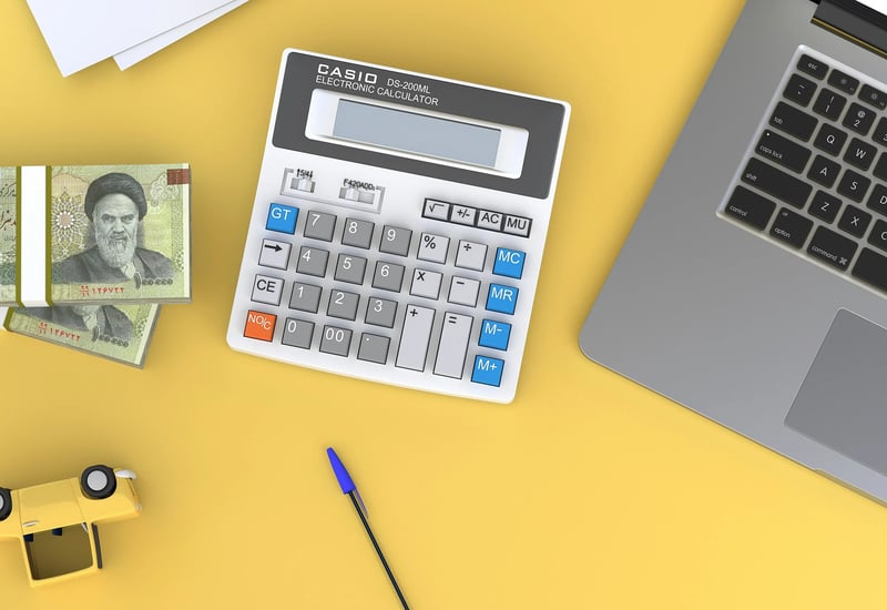 Financial planning with calculator and investment documents